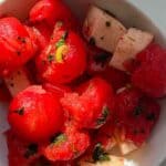 zoomed in watermelon balls, basil, and jicama in salad