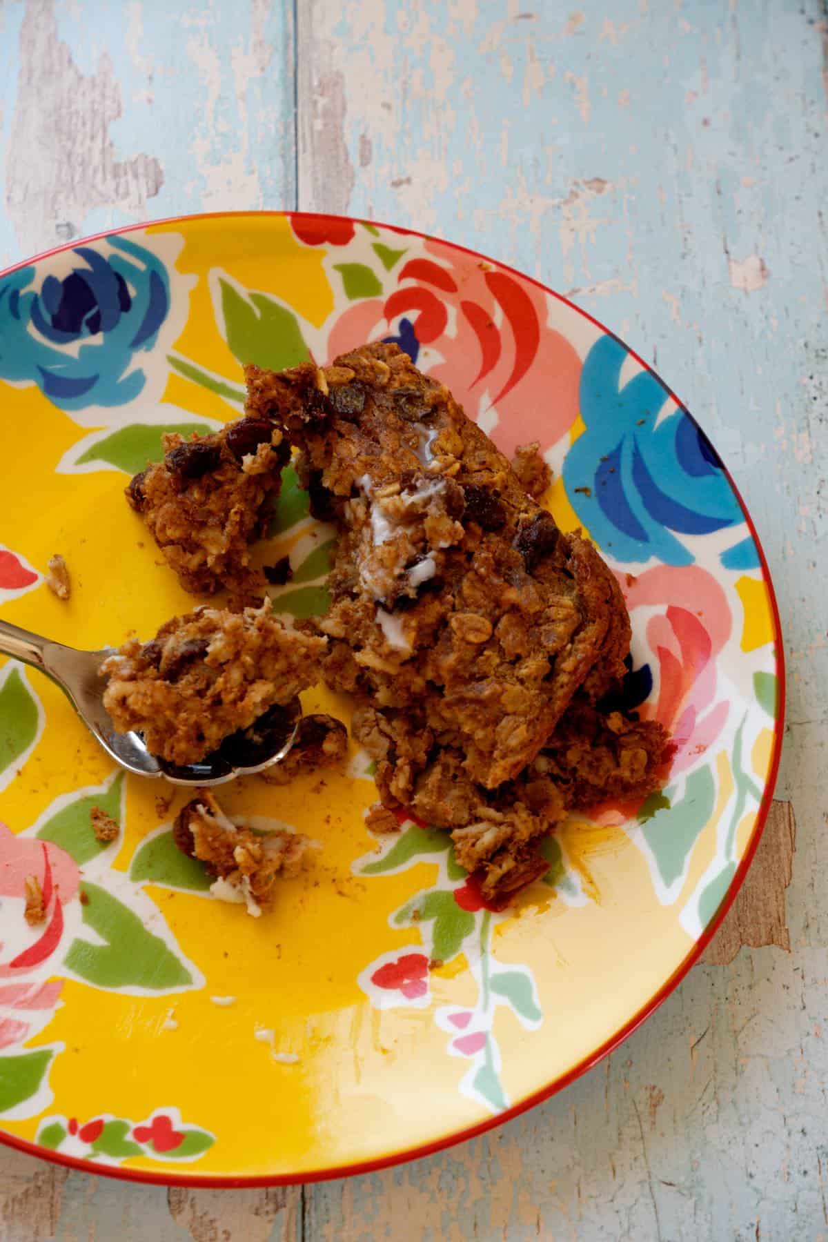 mostly eaten protein baked oats on yellow flower plate